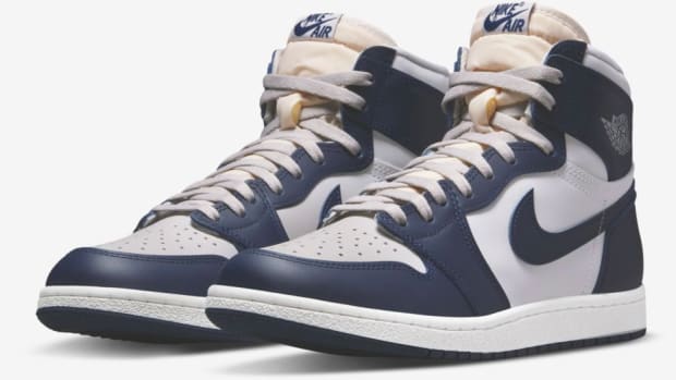 View of navy and grey Air Jordan shoes.